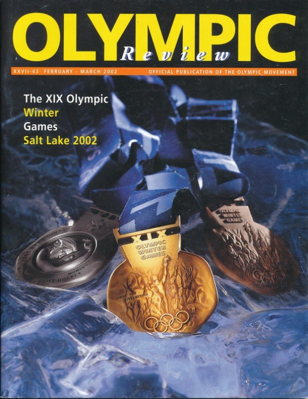 Buchumschlag des 'Olympische Revue Magazin' mit mehreren Medaillen in verschiedenen Größen und Farben und fettem Text.