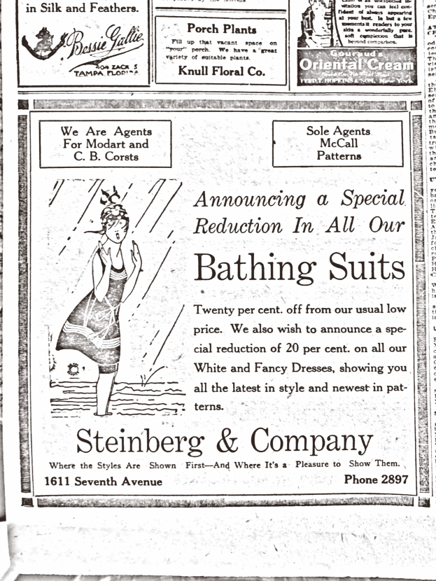 Eine Frau in einem weißen Rollkragenpullover und langen Ärmeln mit einem Dutt, die in der Mitte einer Werbung für Steinberg & Company's Badesachen steht, umgeben von Text.